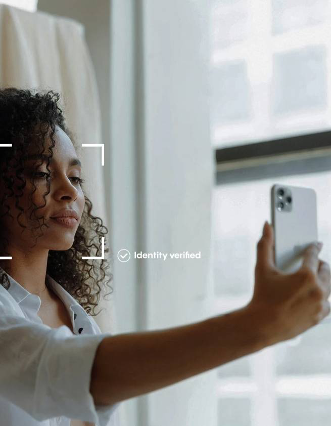 Customer completing biometric identity verification on a phone